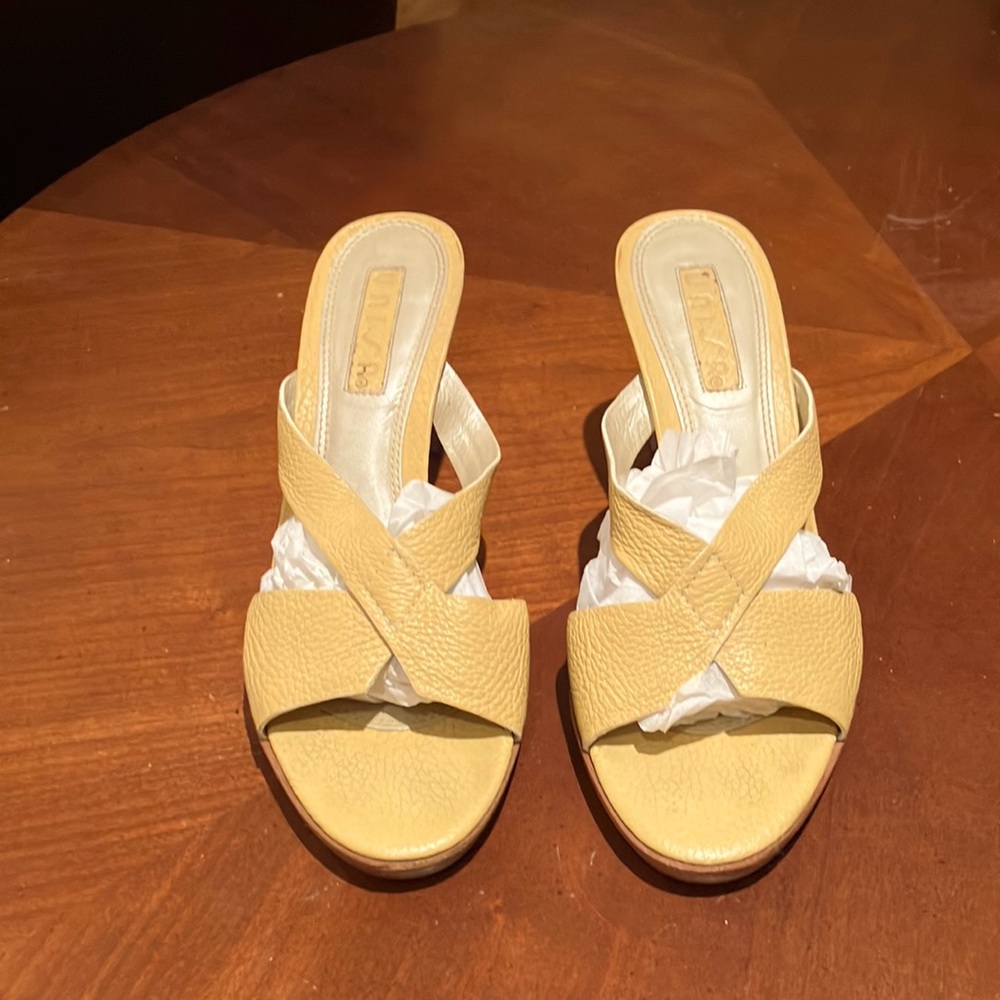 Leather yellow crisscross sandals. Hardly worn. Heels and toes in great shape.